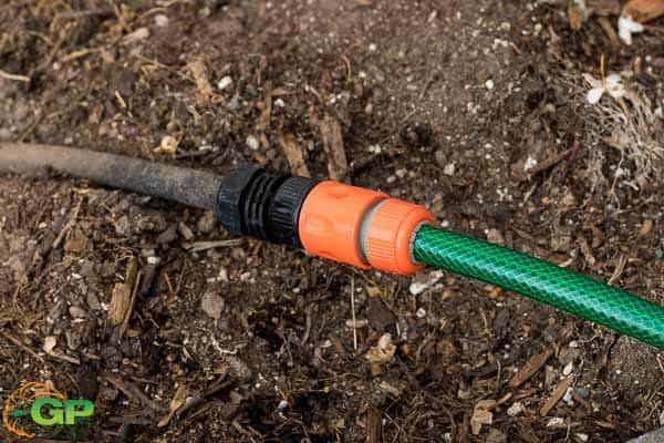 Garden hose connected to weeping hose