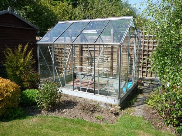 Small glass greenhouse outside