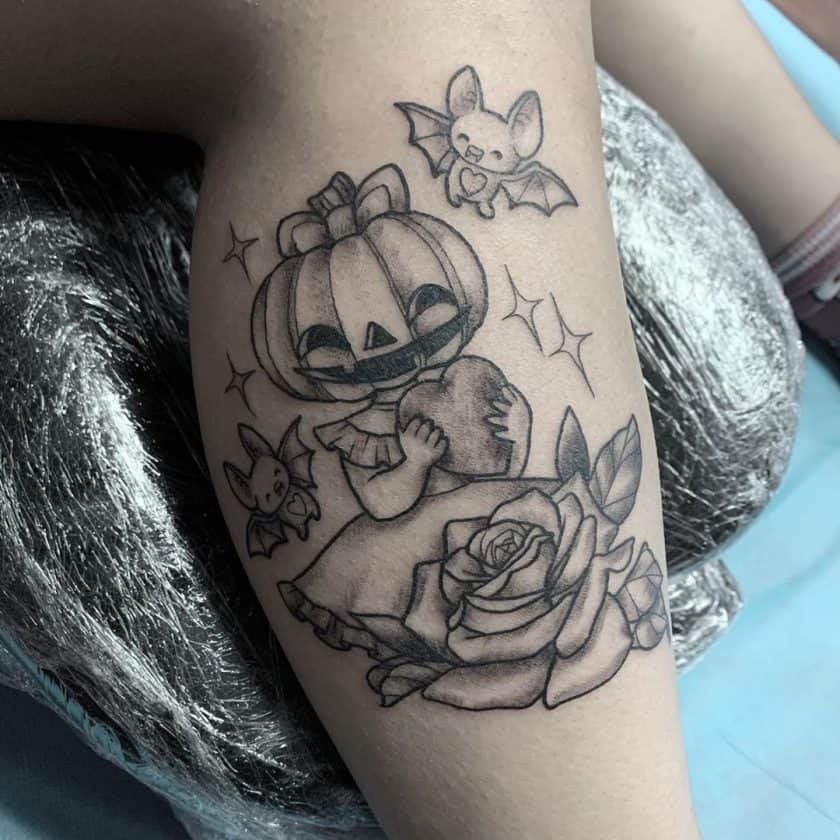 Cute pumpkin tattoo with bats